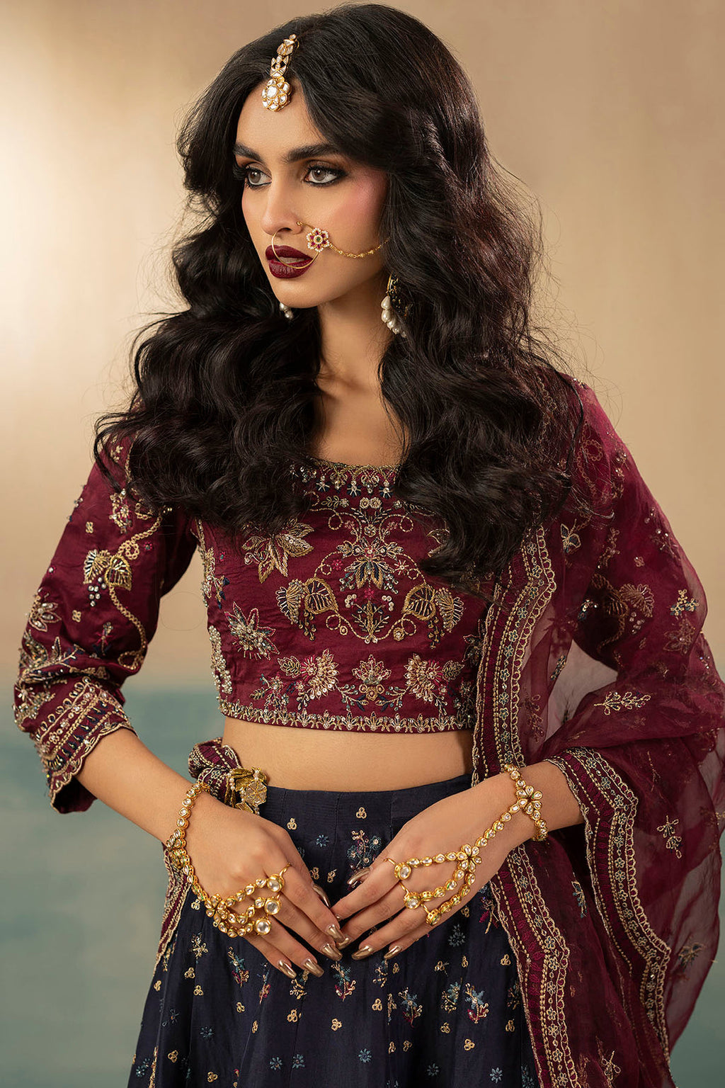 "Close-up detailing on Motifz 0071 Leena stitched silk bodice, highlighting intricate hand-embellished zardozi work, crystal accents, and fine thread embroidery."