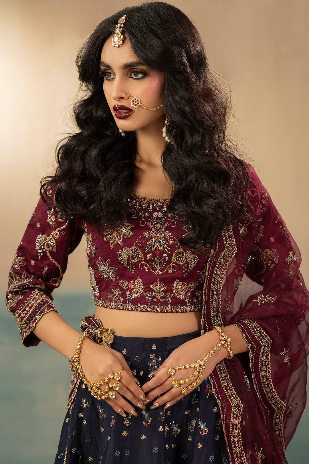 "Close-up detailing on Motifz 0071 Leena stitched silk bodice, highlighting intricate hand-embellished zardozi work, crystal accents, and fine thread embroidery."