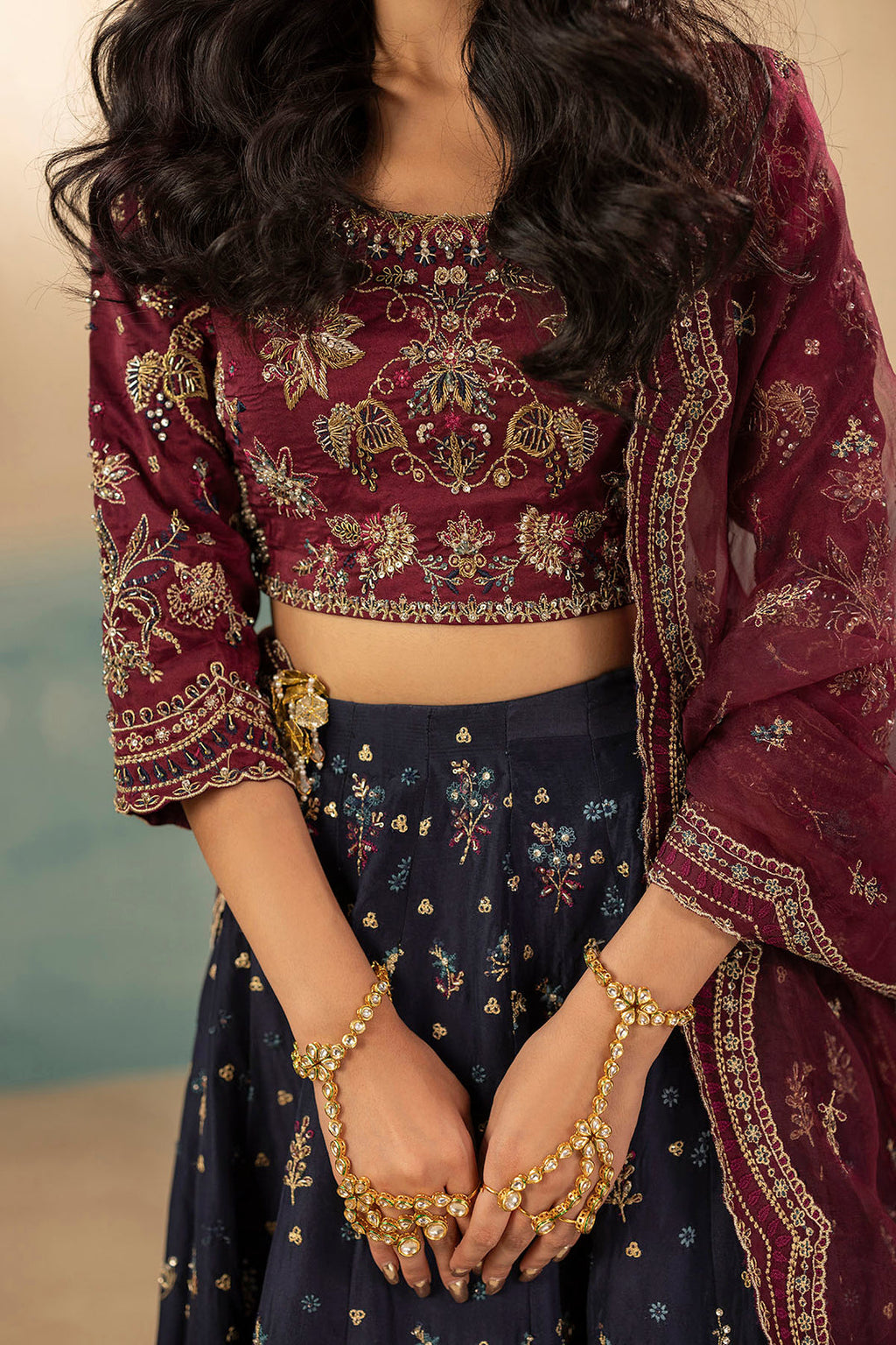 "Focus on sleeve cuffs and hemline patch borders of Motifz 0071 Leena hand embellished silk suit, featuring clean boutique stitching and organza trims."