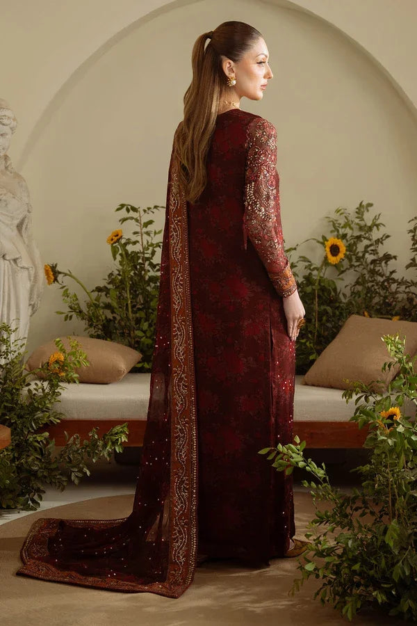 "Detailed view of intricate embroidered borders, cutwork daman finishing, and heavy embellishments on Nureh AM-09 formal suit."