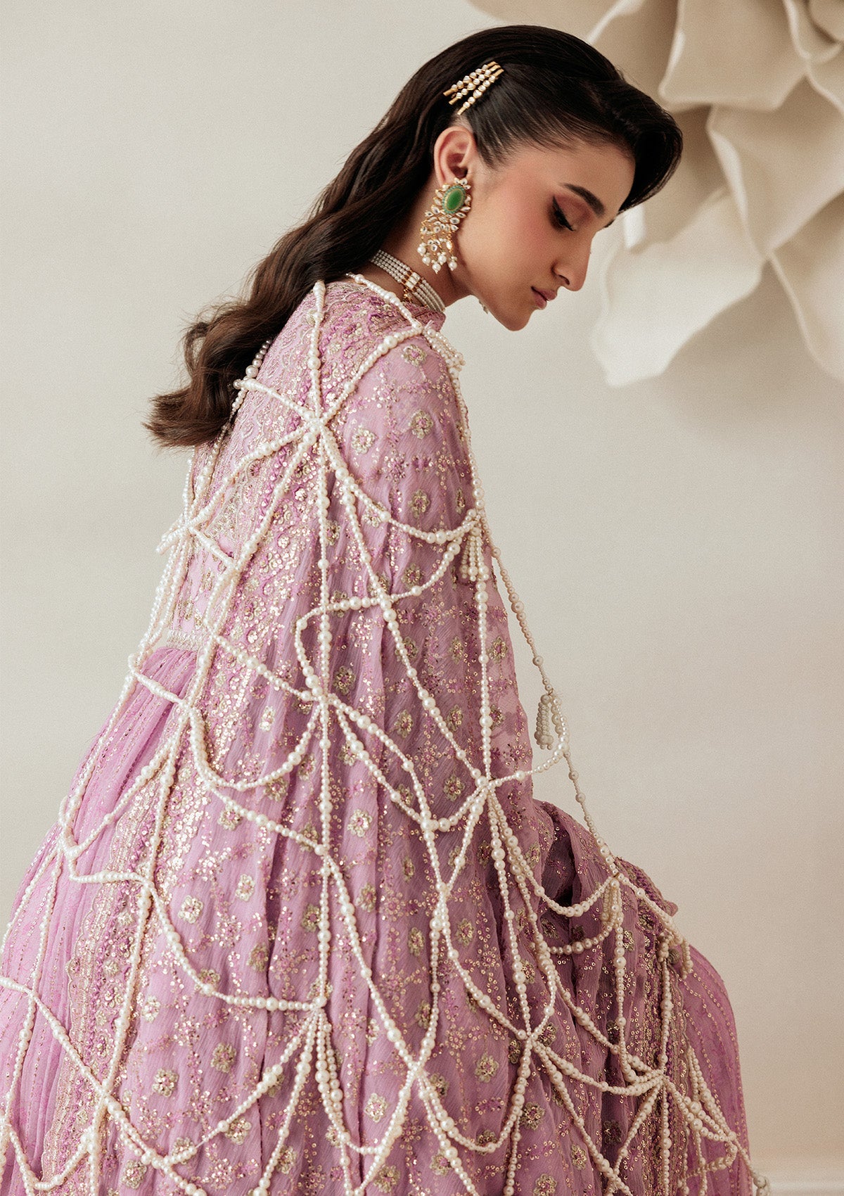 "Lower frame and sleeve focus of Aik Shaam Look A2601, emphasizing multi-textured embroidered patch borders, precise stitching lines, and tailored cuff finishes."