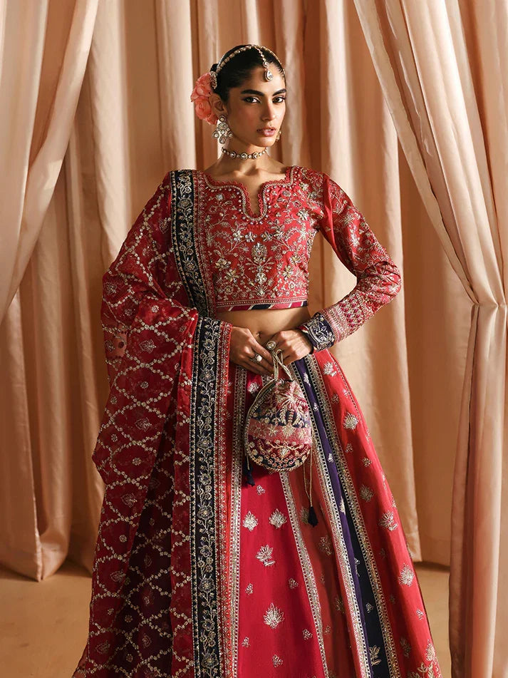 "Focus on the intricate sleeve cuff trimmings and lace hemline details of the Gulaal Aysana stitched luxury suit, showing boutique-quality tailoring."