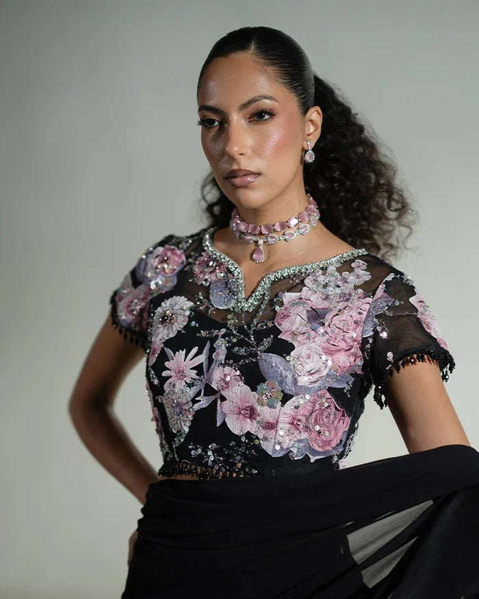 "Close-up detailing on the Vera black saree blouse featuring intricate zardozi, crystal hand work, and velvet applique accents."