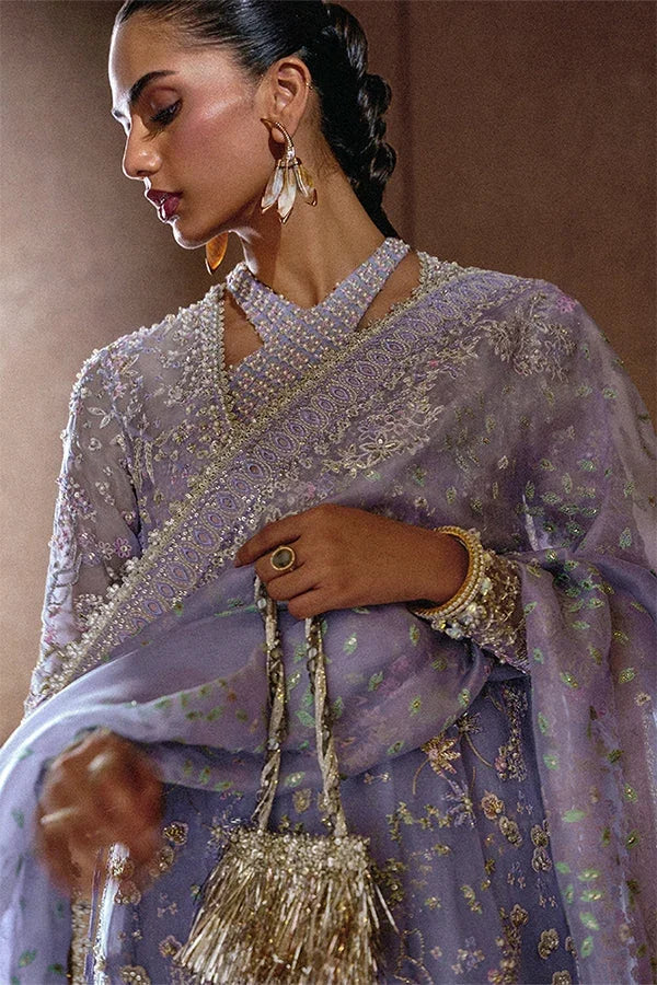 "Close-up of hand-worked zardozi, sparkling sequin accents, and fine resham threadwork embroidery on Suffuse Calira shirt bodice."