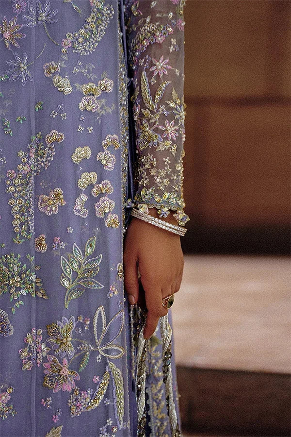 "Detailed view of intricate embroidered organza borders and scalloped hemline finishings on Suffuse Calira wedding suit."