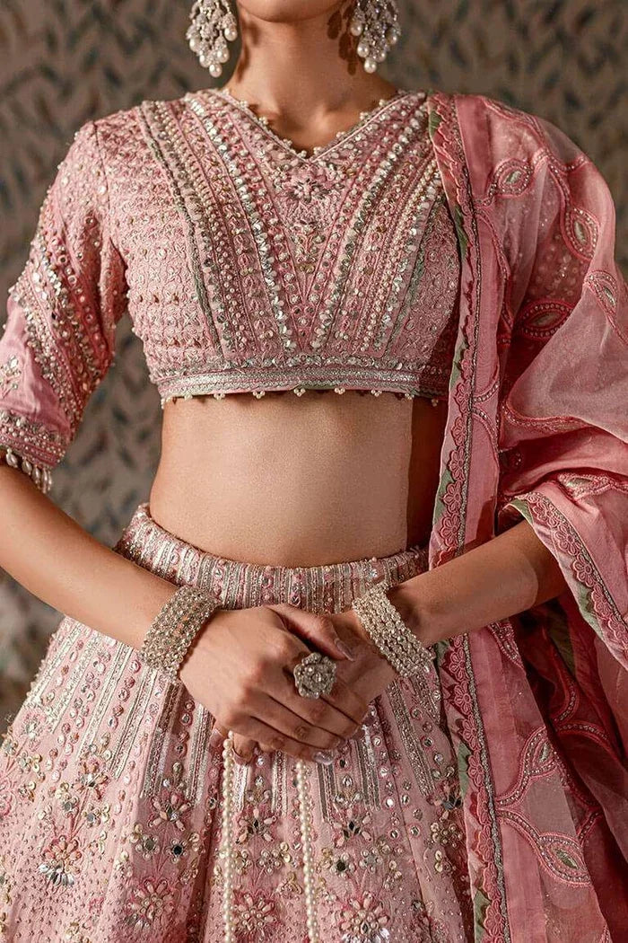 "Close-up detailing on the Vera pink choli featuring intricate zardozi, Swarovski crystals, pearls, and mirror hand work."