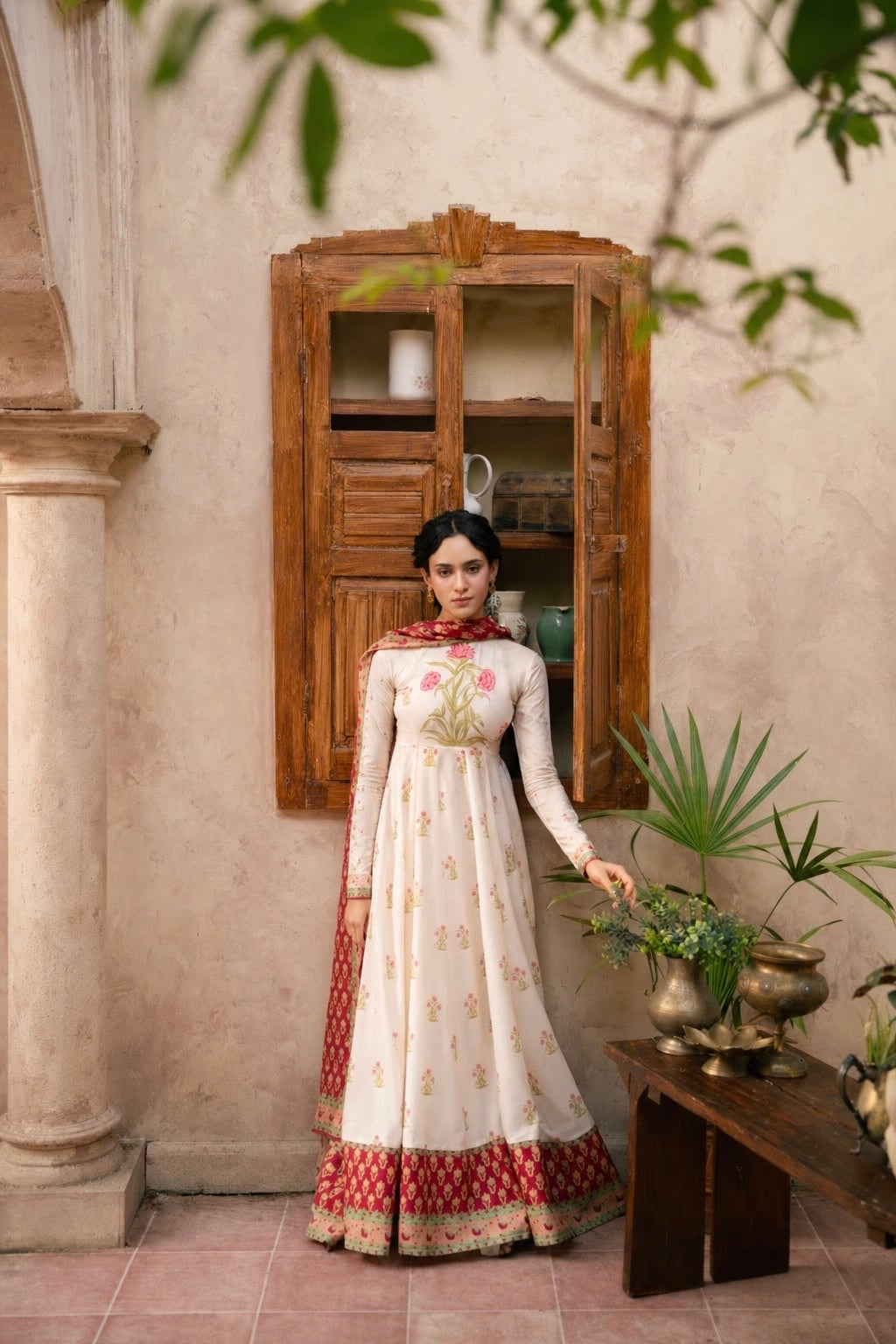 "Focus on the wide flared hemline border and sleeve cuff details of the LXM Cream White stitched Kalidaar frock, showing boutique-quality tailoring."