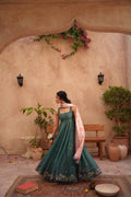 "Mirha Collections LXM Deep Green Kalidaar stitched three-piece suit. Full-length flared Pishwas frock view featuring intricate embroidery, matching dupatta, and trousers."