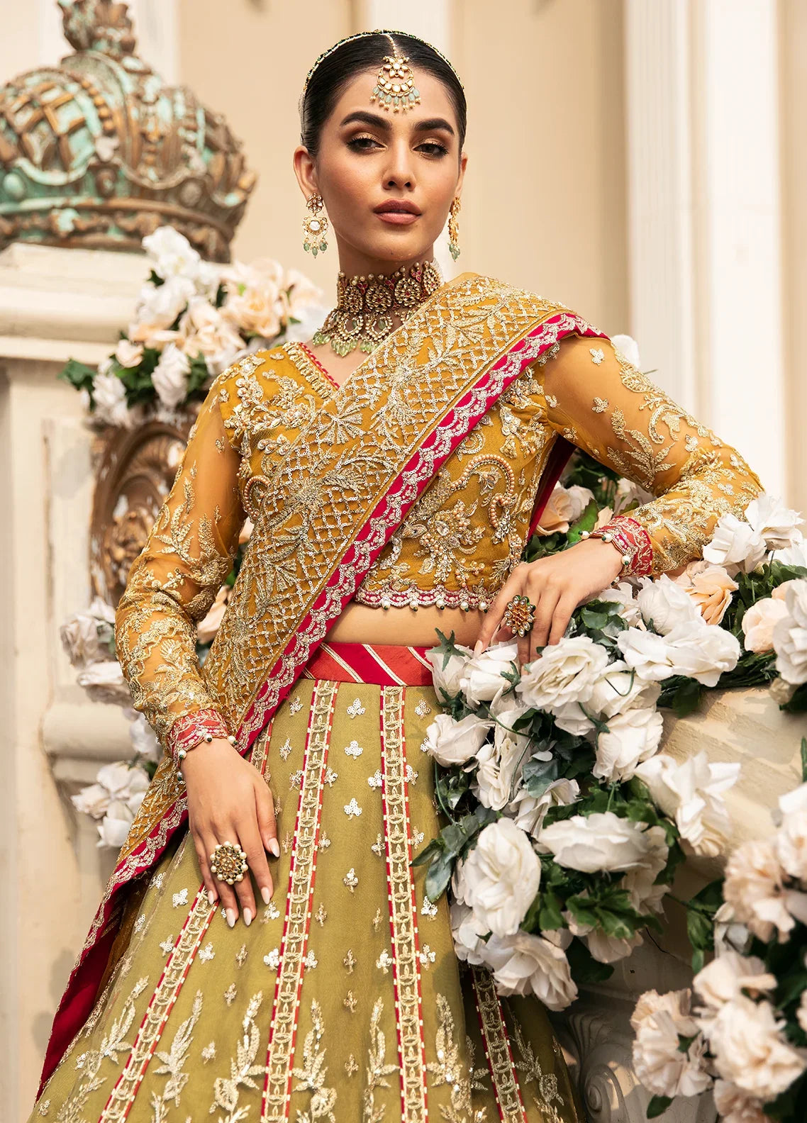 "Focus on the intricate sleeve cuff trimmings and embroidered hemline raw silk border details of the Gulaal Diya stitched luxury suit, showing boutique-quality tailoring."
