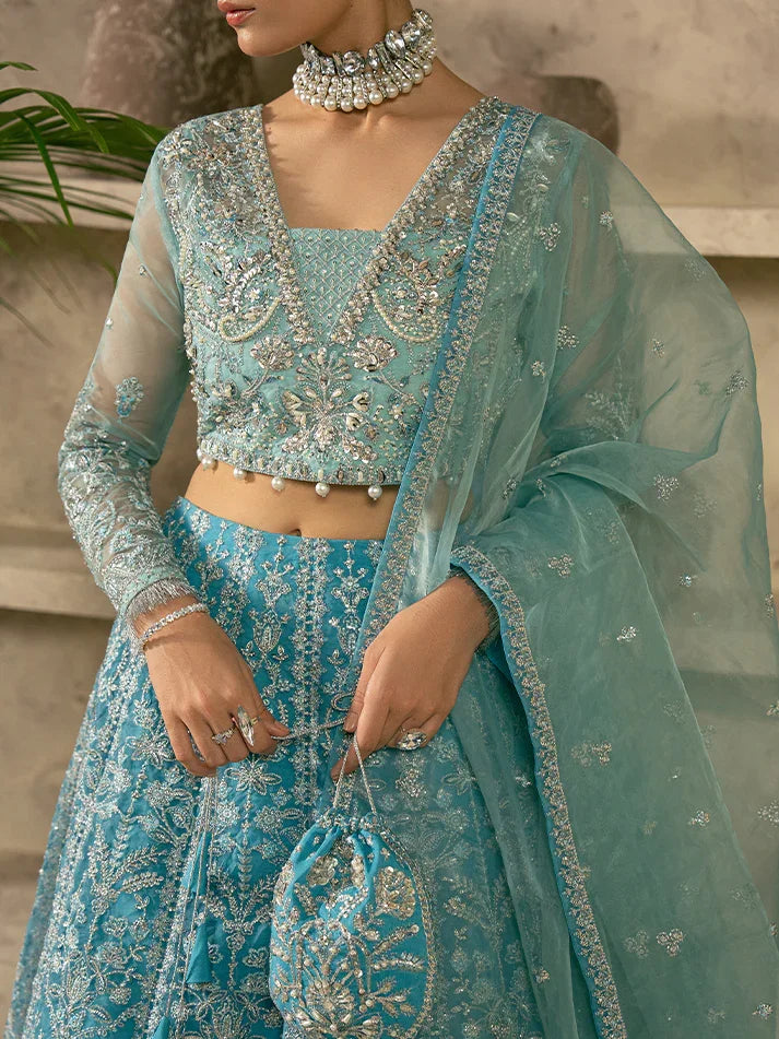 "Close-up detailing on the Gulaal Elaria shirt bodice, displaying hand-worked adda embellishments, sheesha accents, panni embroidery, and fine organza texture."