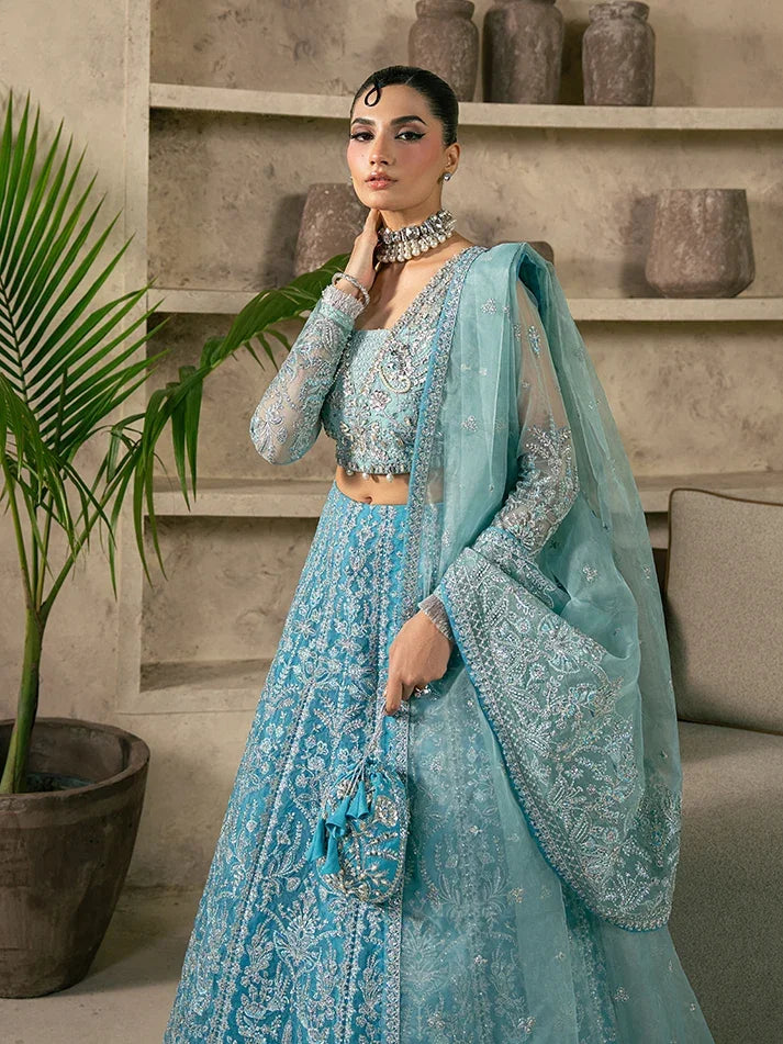 "Focus on the intricate sleeve cuff trimmings and cutwork hemline details of the Gulaal Elaria stitched luxury suit, showing boutique-quality tailoring."