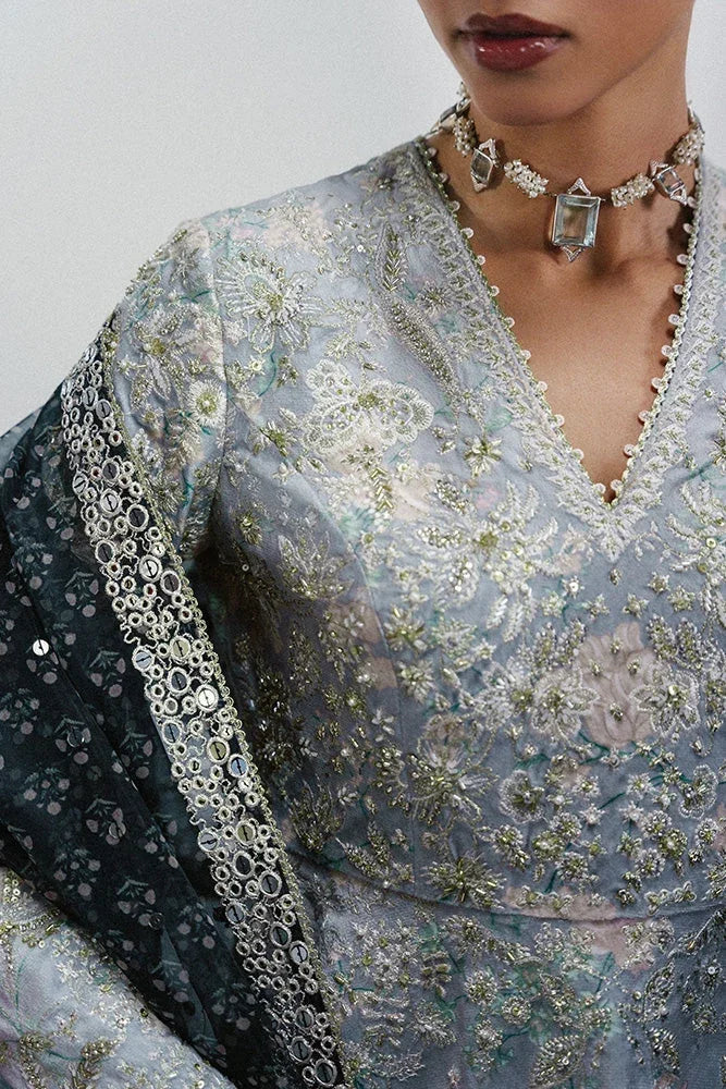 "Close-up of fine resham embroidery, hand-worked pearl accents, and lace detailing on the Suffuse Evia silk shirt neckline."