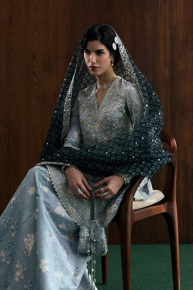 "Detailed view of sleeve border trim and embroidered hemline finishings on the Suffuse Evia silk pret outfit."