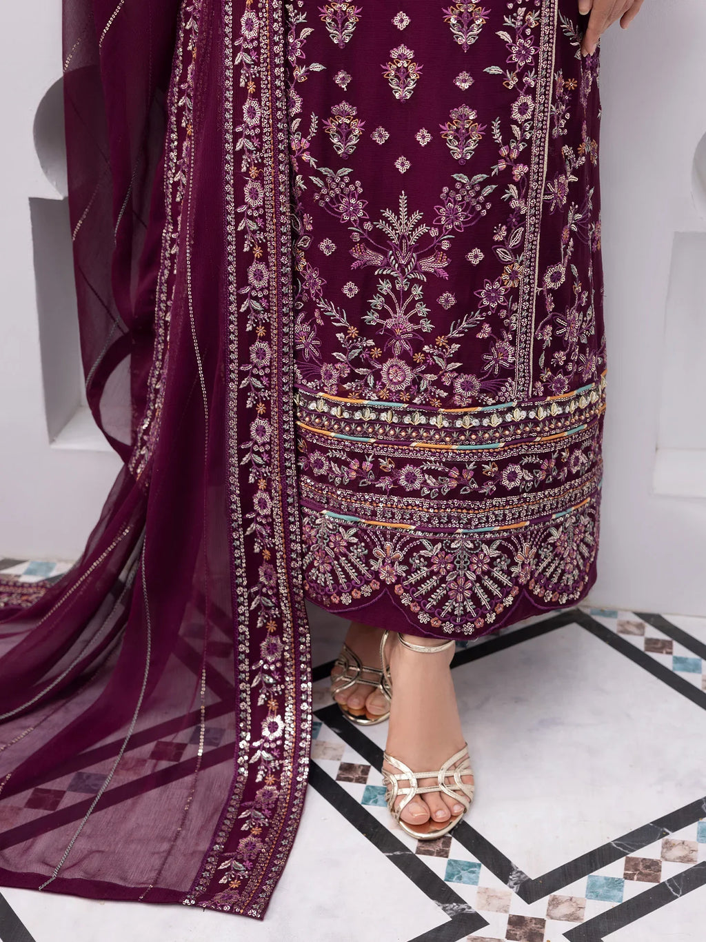 "Focus on the intricate sleeve cuff trimmings and lace hemline details of the Gulaal Étincelle stitched luxury suit, showing boutique-quality tailoring."