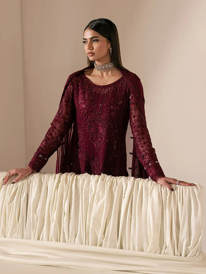 "Focus on the intricate sleeve cuff trimmings and lace hemline details of the Gulaal Etta stitched luxury suit, showing boutique-quality tailoring."