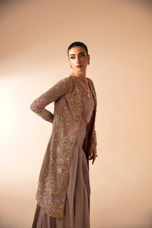 "Focus on matching embellished organza dupatta framed with four-sided embroidered borders paired with Mysie by Tahira Faia set."
