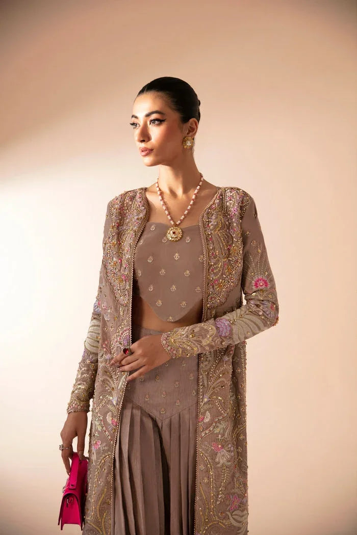 "Detailed view of intricate embroidered organza borders and cutwork daman finishings on Mysie by Tahira Faia formal suit."