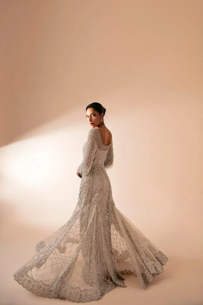 "Focus on matching embellished organza dupatta framed with four-sided embroidered borders paired with Mysie by Tahira Fere set."