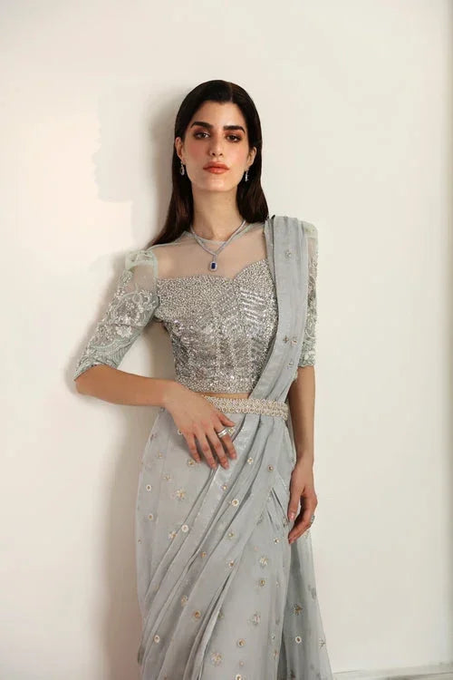 "Close-up of intricate hand-embellishment, sparkling crystals, and zardozi detailing on Mysie by Tahira Hafsa ice blue choli."