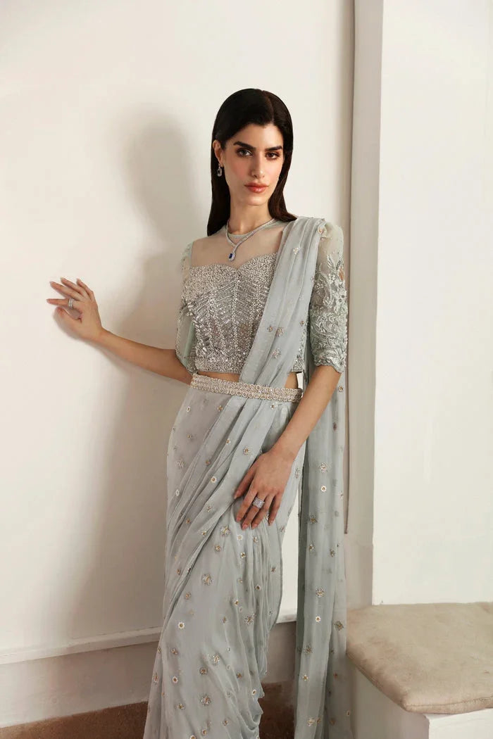 "Detailed view of fluid chiffon drape and net border finishing on Mysie by Tahira Hafsa formal saree."