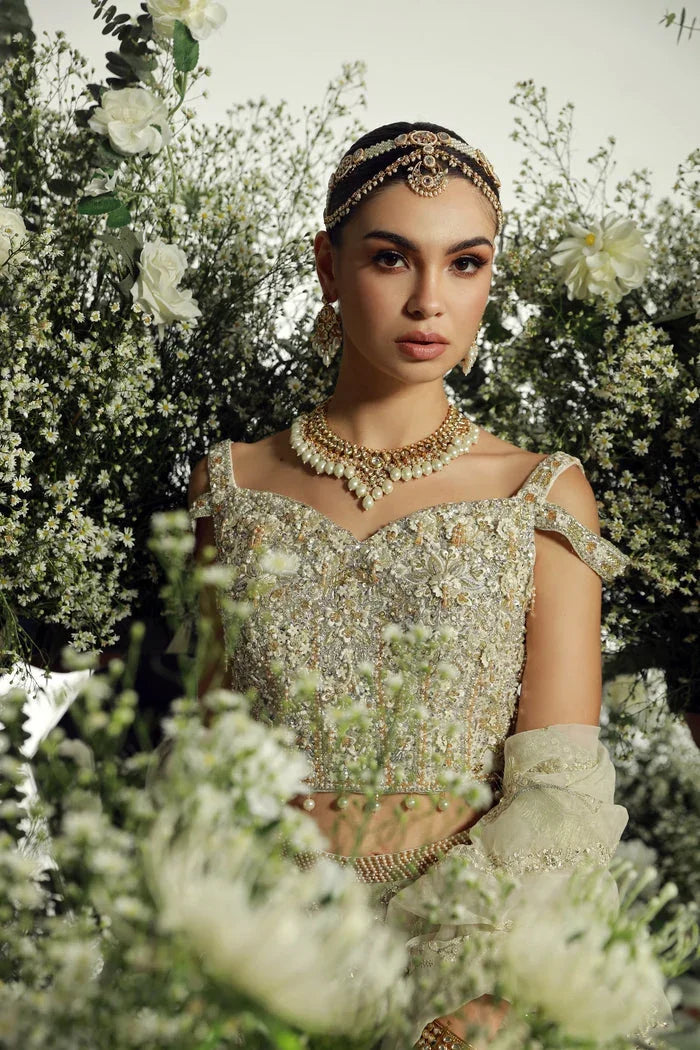 "Close-up of exquisite hand-worked zardozi, crystal accents, and resham threadwork embroidery on Mysie by Tahira Hansel shirt."