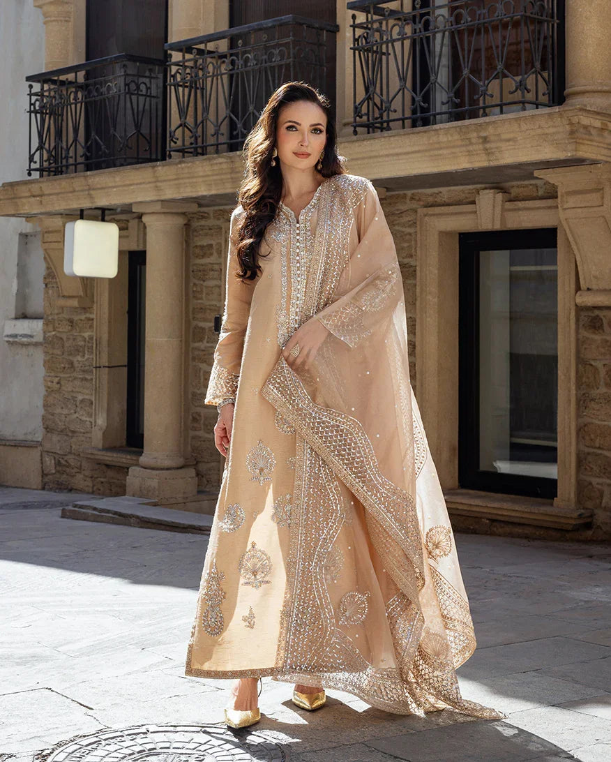 "Mirha Collections Mushq Hazel Cascade golden beige raw silk luxury stitched three-piece suit. Full-length front view featuring embroidered raw silk shirt, raw silk trousers, and organza dupatta."