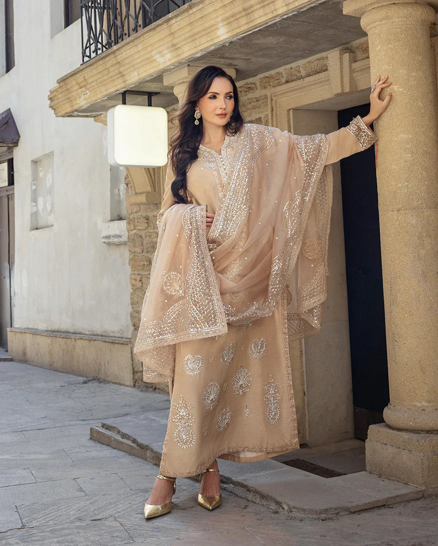 "Focus on the delicate sleeve cuff embellishments, handcrafted tassels, and pearl finishings of the Mushq Hazel Cascade luxury suit, showing boutique-quality tailoring."