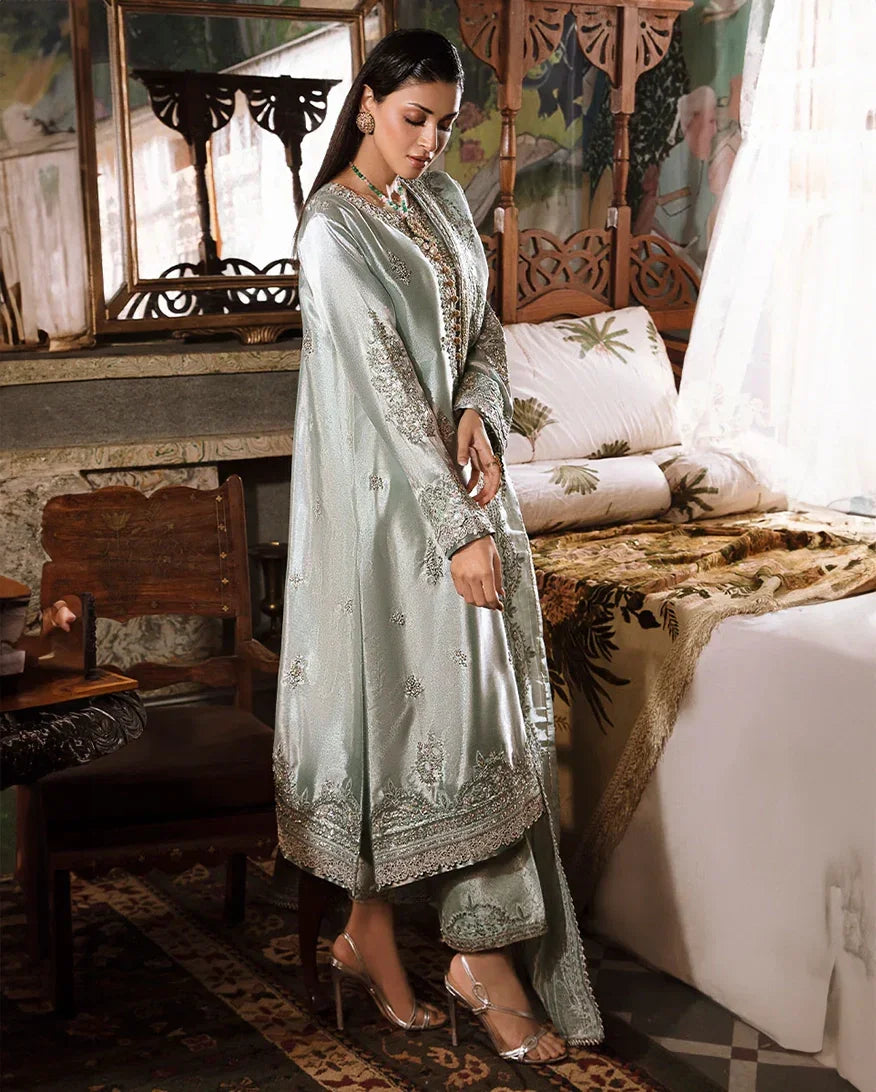 "Focus on the intricate sleeve cuff trimmings and lace hemline details of the Mushq Heer stitched luxury suit, showing boutique-quality tailoring."