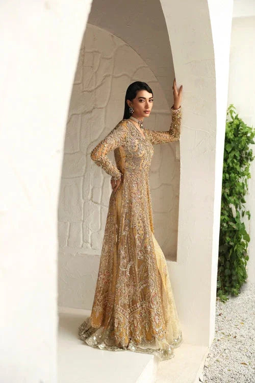 "Full profile view showing fluid tulle shirt overlay and fitted skirt silhouette of Mysie by Tahira Humaira."