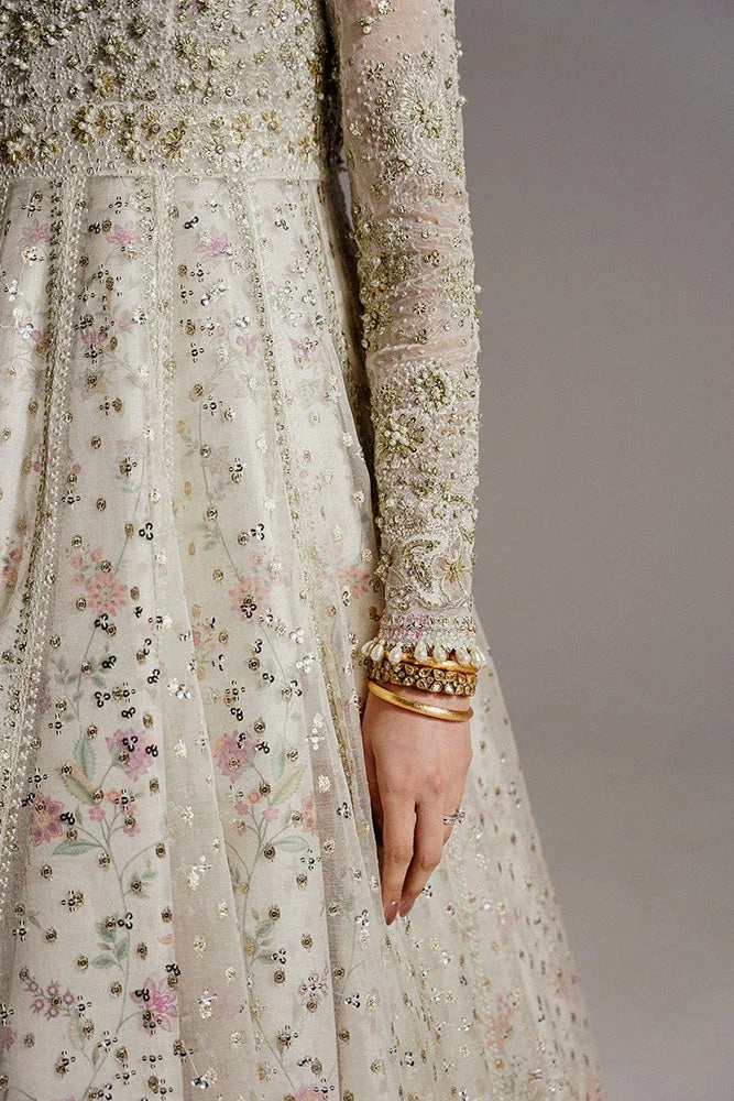 "Detailed view of intricate embroidered organza borders and embellishments on the hemline of Suffuse Ishani wedding formal."