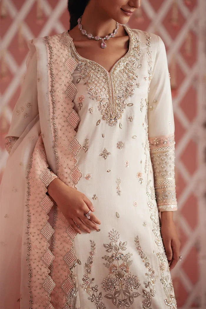 "Close-up of resham, sequin and pearl embroidery on ivory raw silk formal shirt"