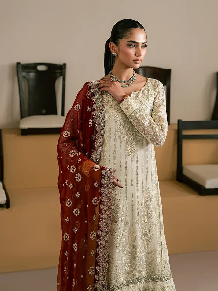 "Focus on the intricate sleeve cuff trimmings and lace hemline details of the Gulaal Iyla stitched luxury suit, showing boutique-quality tailoring."