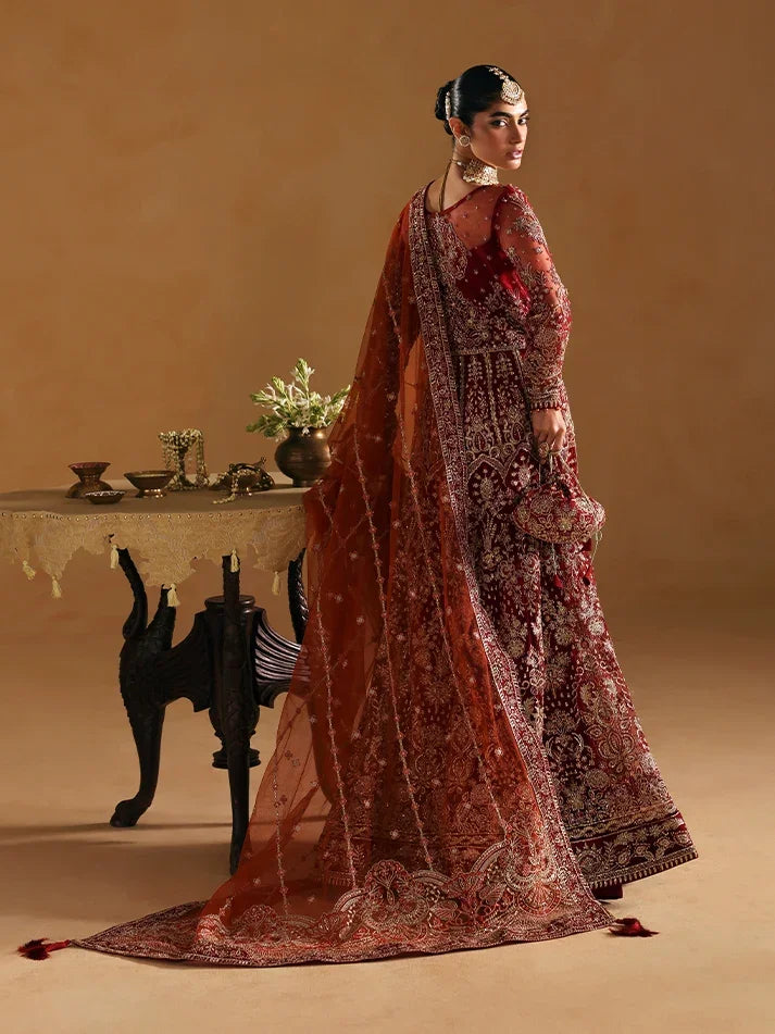 "Focus on the intricate sleeve cuff trimmings and lace hemline details of the Gulaal Jahari stitched luxury suit, showing boutique-quality tailoring."