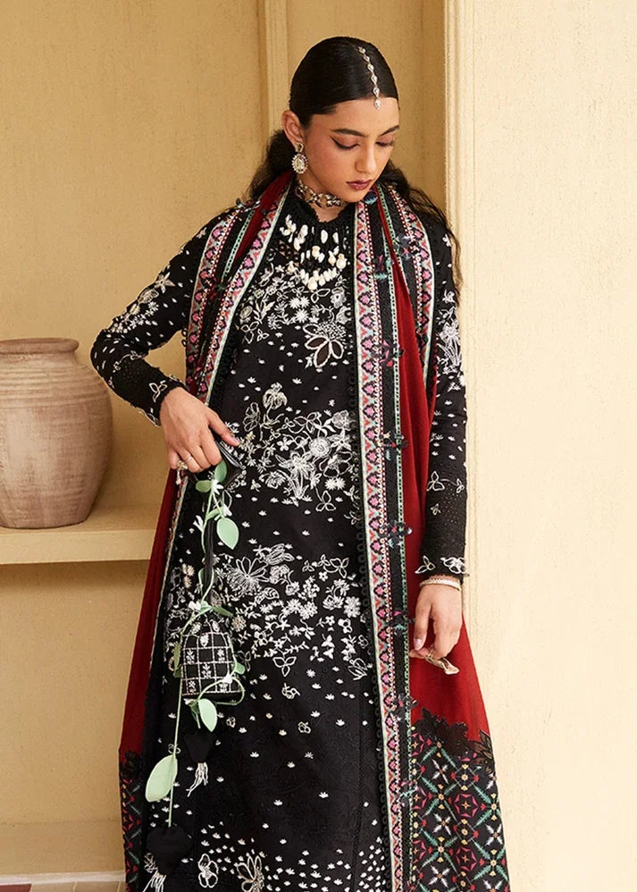 "Detailed view of cutwork embroidered daman borders and tailored cambric trousers on Suffuse Kiran lawn suit."