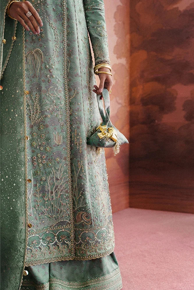 "Close-up of gold lace panels, delicate embroidery, and subtle sequin accents on the Suffuse Lisha sage green angrakha shirt."