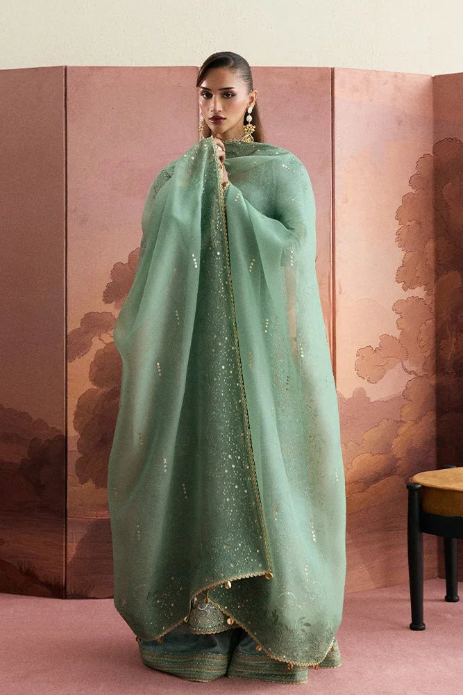 "Focus on matching sage green organza dupatta with four-sided leaf embroidery and sequin lines paired with Suffuse Lisha set."