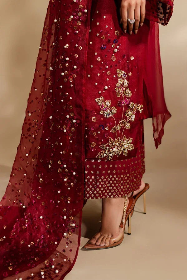 "Detailed view of intricate embroidered borders, cutwork daman finishing, and heavy embellishments on Nureh Love Struck formal suit."