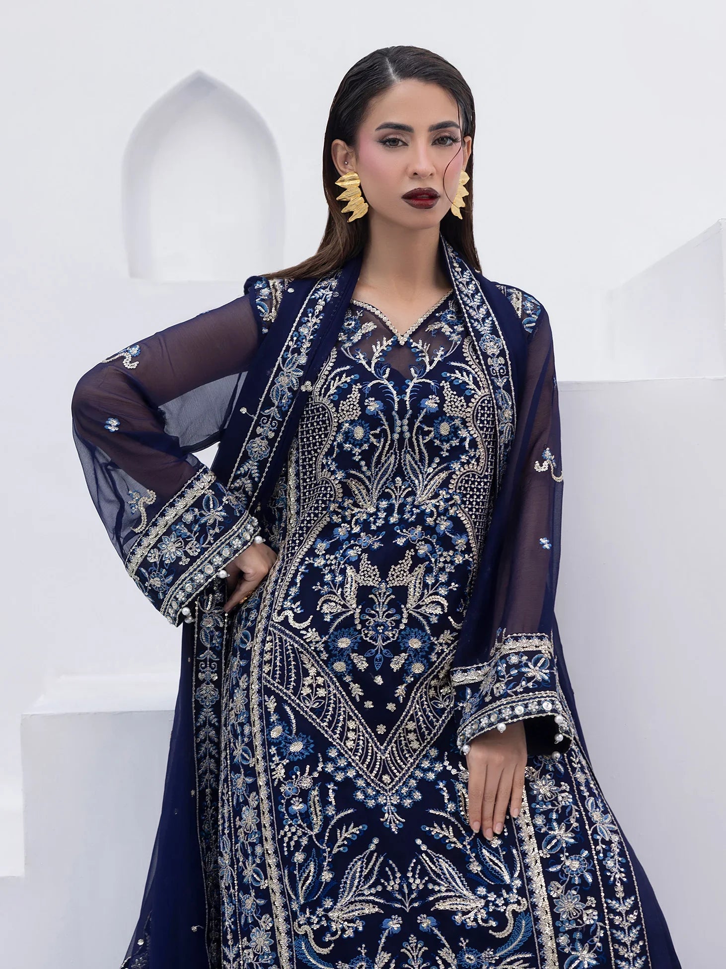 "Detailed drape view of the fluid embroidered statement dupatta paired with the Gulaal Lueur formal suit from Mirha Collections."