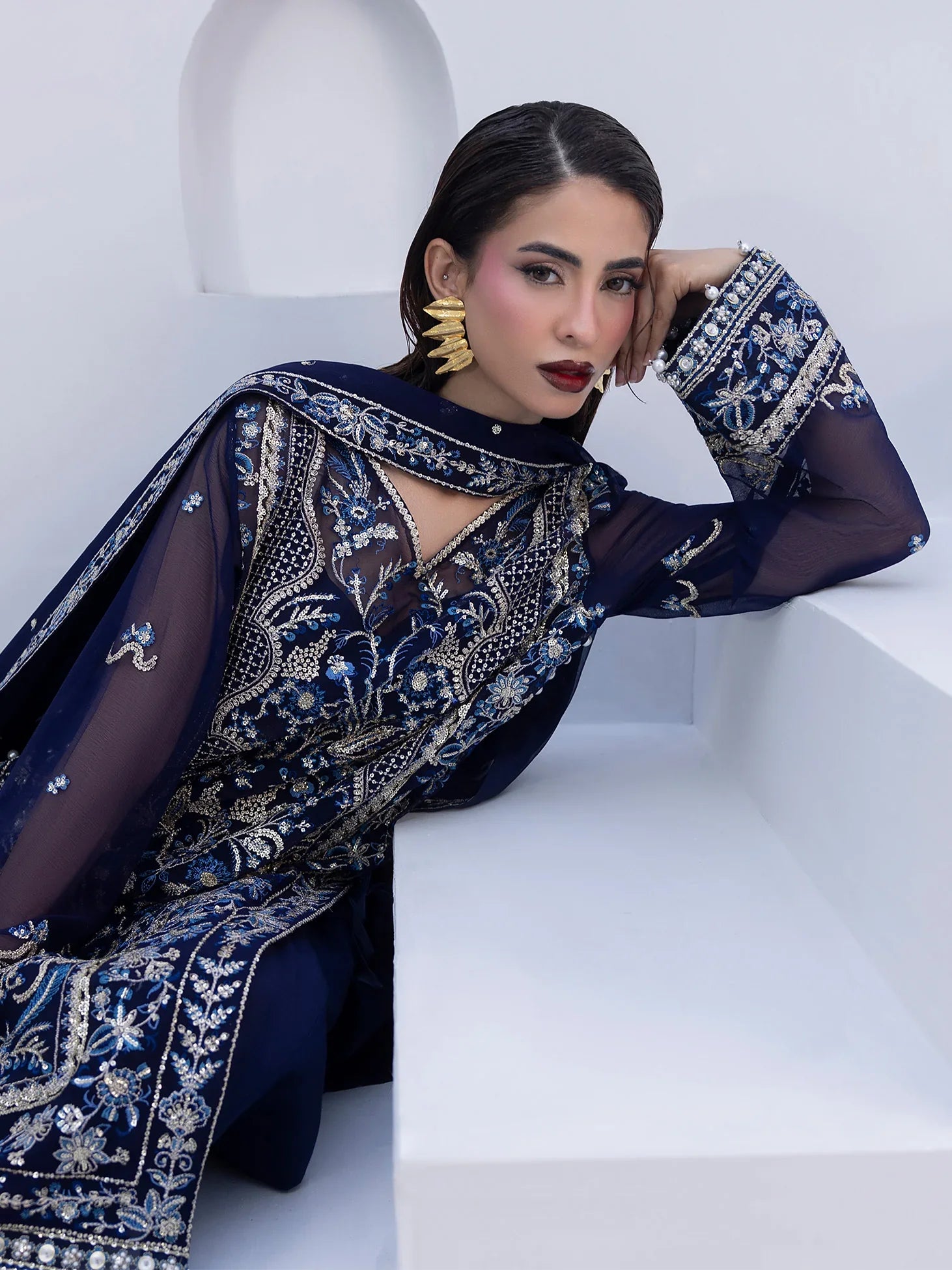 "Close-up detailing on the Gulaal Lueur shirt bodice, displaying fine threadwork embroidery, shimmering sequin accents, and soft fabric texture."