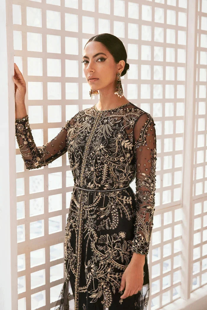 "Detailed view of intricate borders, cutwork daman finishing, and heavy embellishments on Mysie by Tahira Lata formal suit."