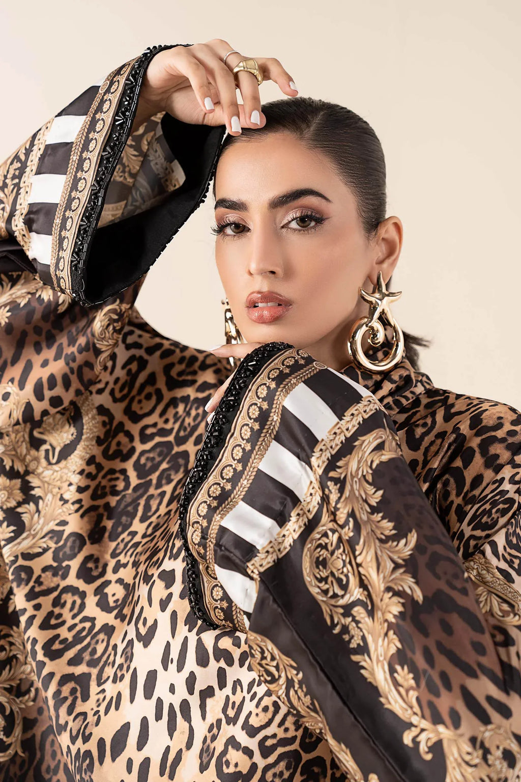 "Close-up detailing on the Maria B MBS-W25-19 Rust shirt bodice, displaying hand-worked adda embellishments, sparkling sequin accents, and rich sateen fabric texture."