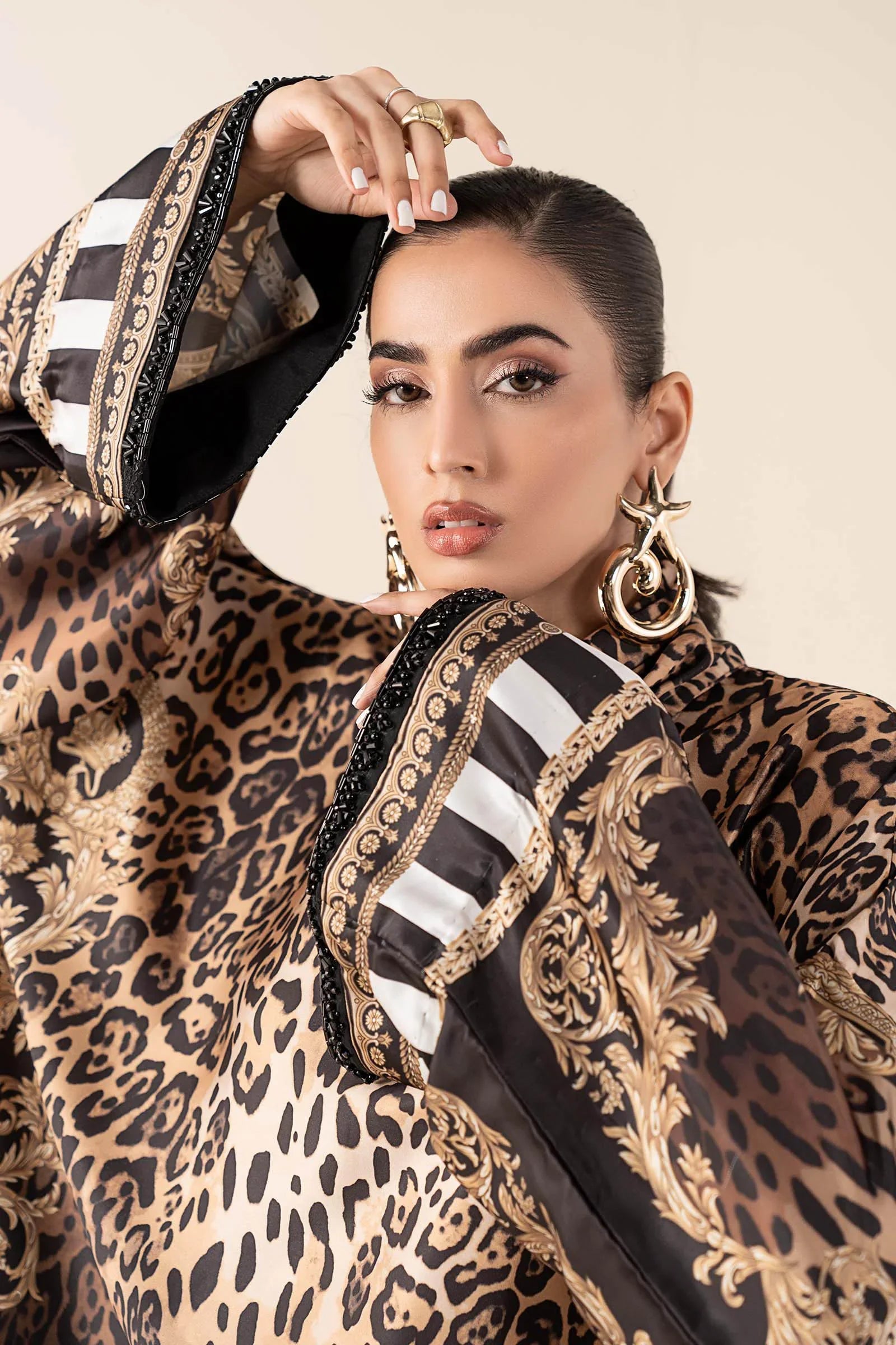 "Close-up detailing on the Maria B MBS-W25-19 Rust shirt bodice, displaying hand-worked adda embellishments, sparkling sequin accents, and rich sateen fabric texture."