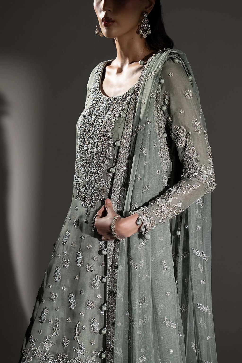 "Close-up of hand-embellished zardozi, antique tilla, and sequin craftsmanship on the Maria B MC-26V1-05 velvet neckline."