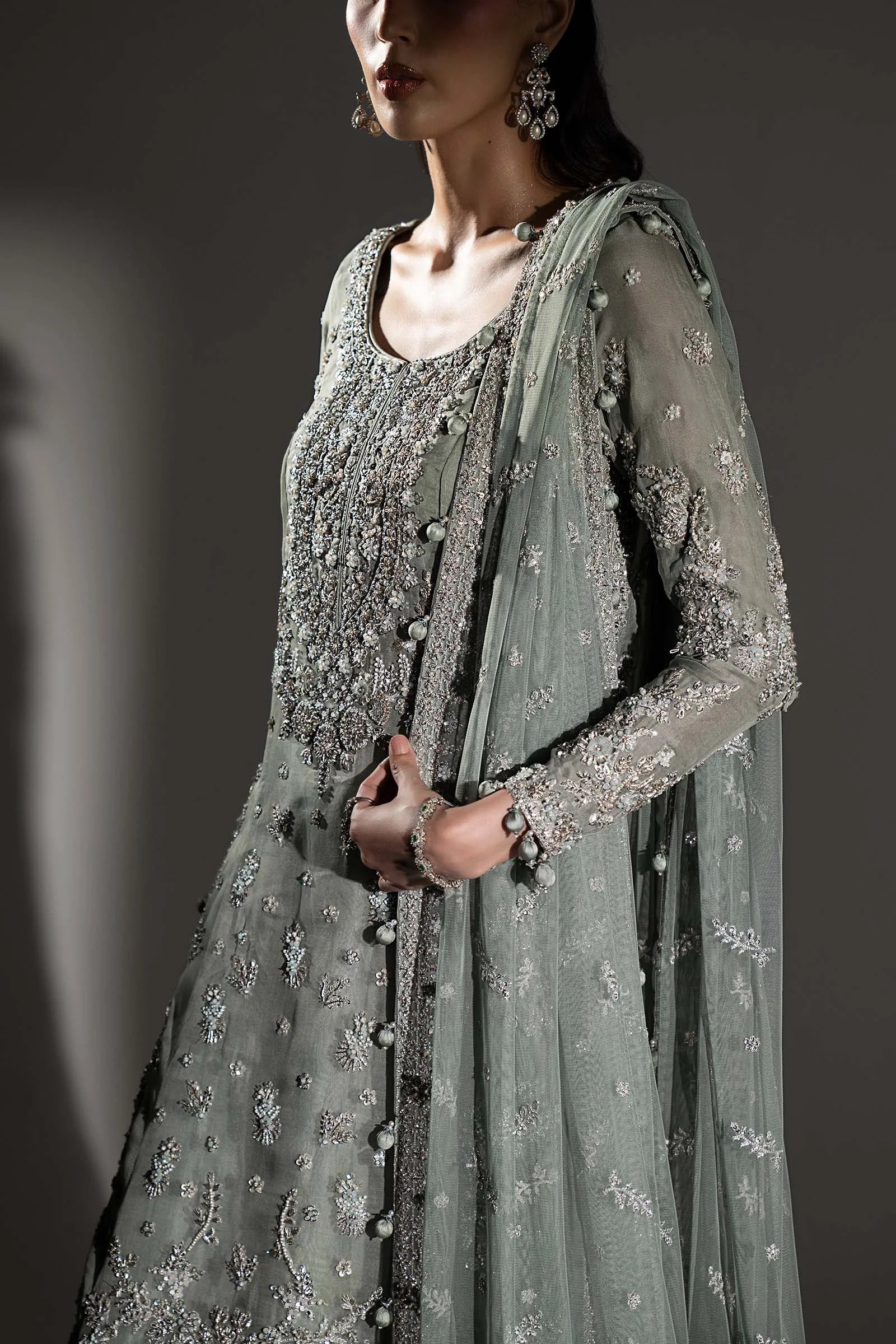 "Close-up of hand-embellished zardozi, antique tilla, and sequin craftsmanship on the Maria B MC-26V1-05 velvet neckline."