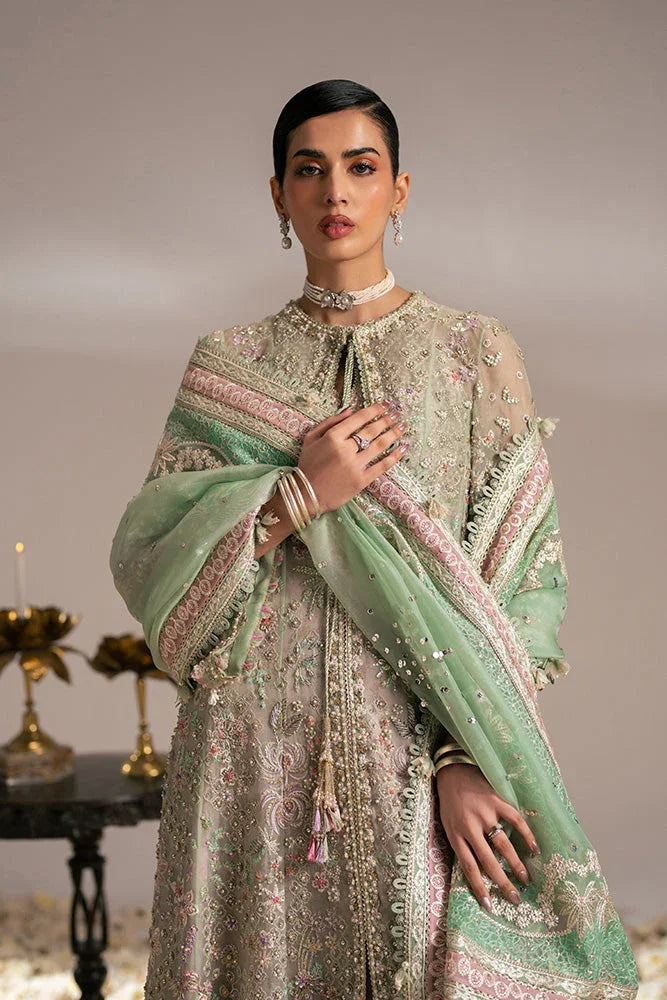 "Detailed view of multi-tonal flared kalis and intricate border trims on Suffuse Mehtab wedding gown."
