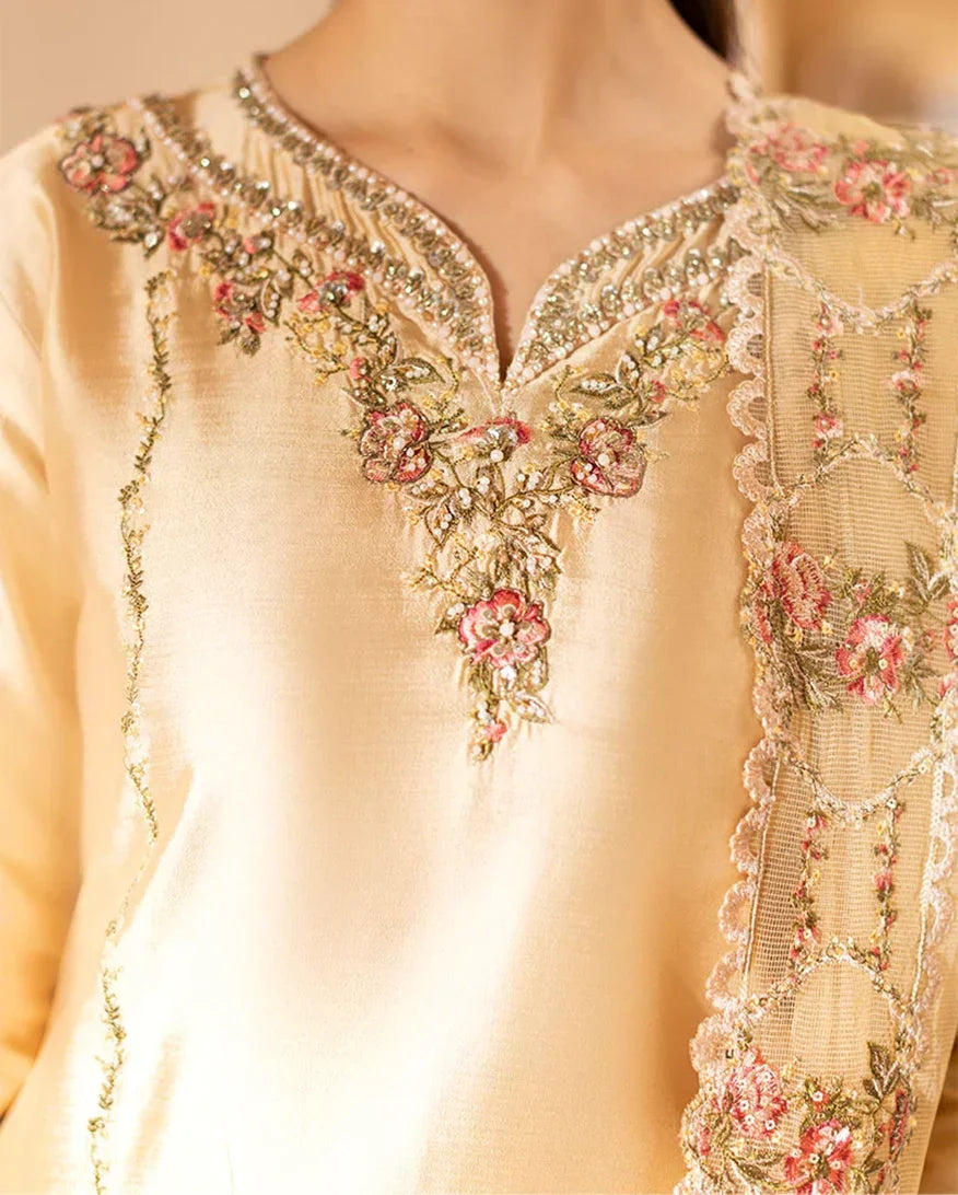 "Close-up detailing on the Mushq Aurea shirt bodice, displaying fine threadwork embroidery, embellished neck finishes, and soft fabric texture."