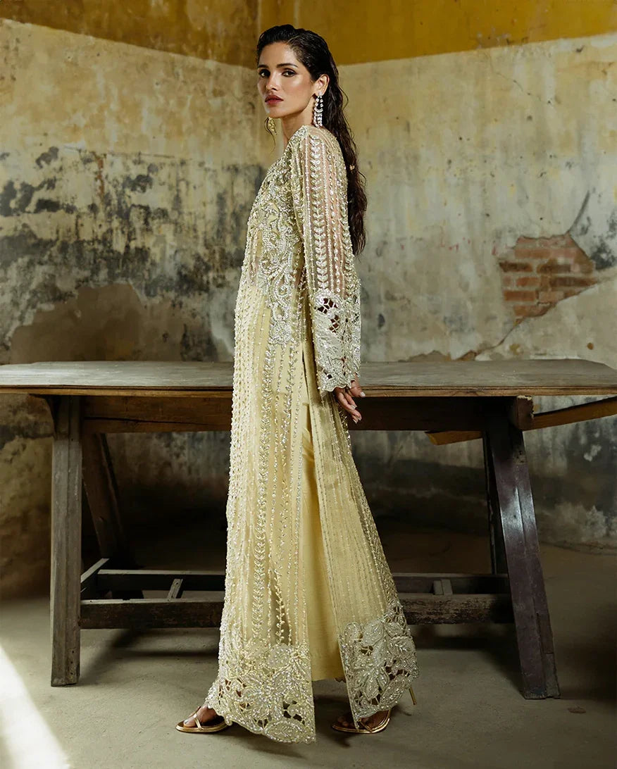 "Focus on the intricate sleeve cuff trimmings and lace hemline details of the Mushq Marguerite stitched luxury suit, showing boutique-quality tailoring."