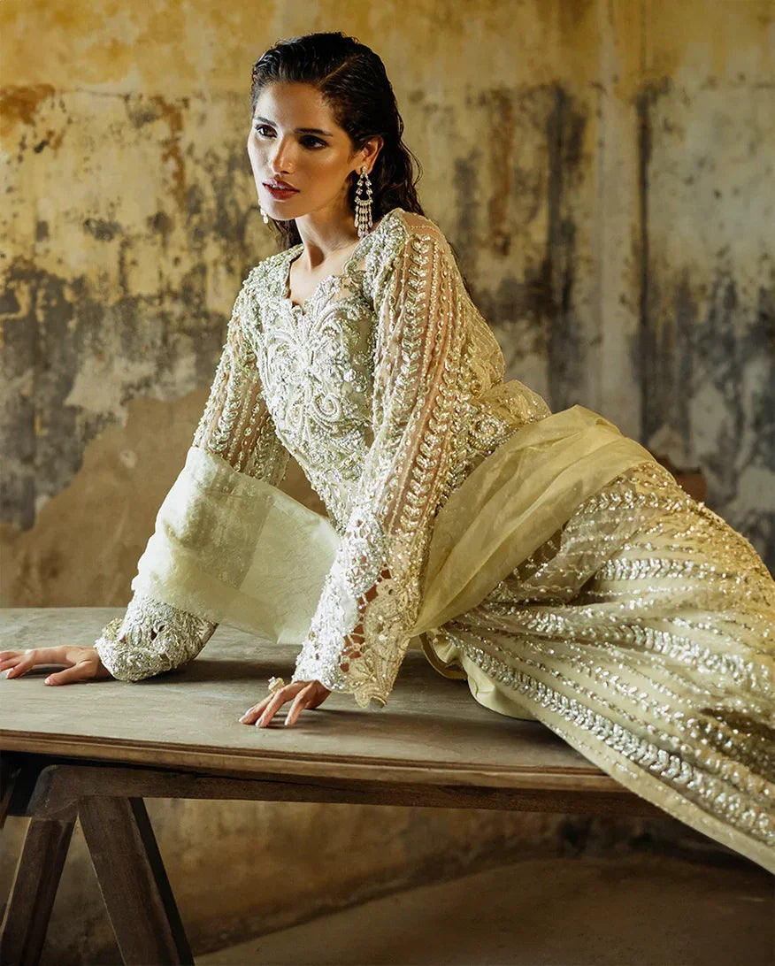 "Close-up detailing on the Mushq Marguerite shirt bodice, displaying fine floral threadwork embroidery, embellished neck finishes, and soft fabric texture."
