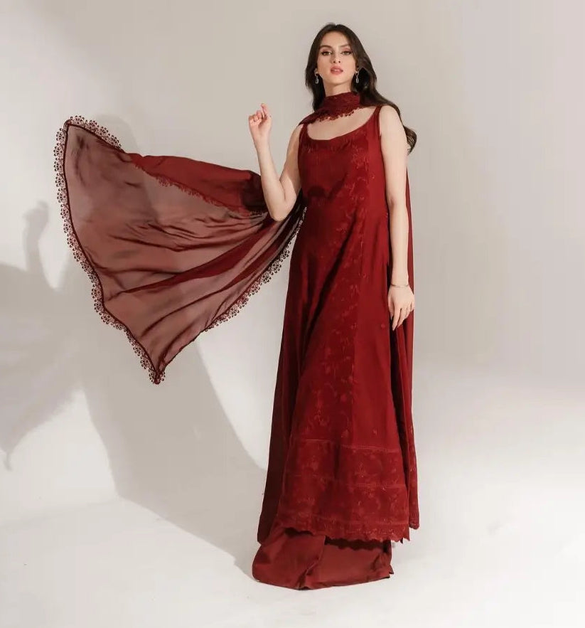 "Draped view of the medium silk dupatta featuring intricate lace trim border details paired with the cotton net outfit."