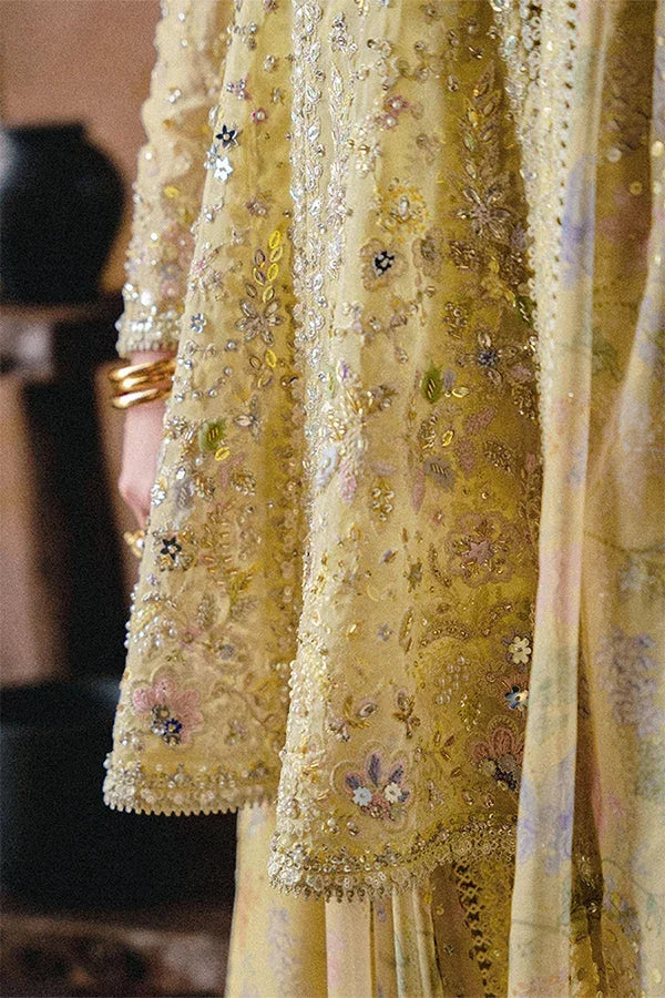 "Detailed view of intricate embroidered organza borders and scalloped hemline finishings on Suffuse Merivah wedding suit."